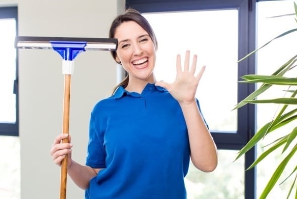 smiling-looking-friendly-showing-number-five
